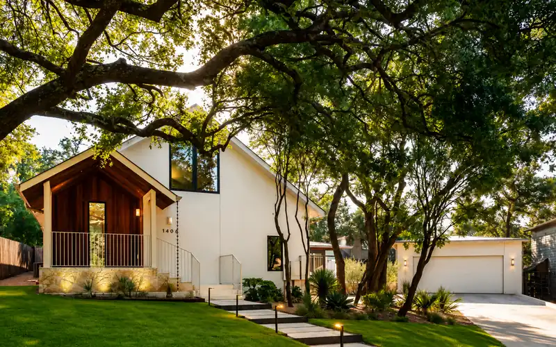 White house under live oaks at golden hour